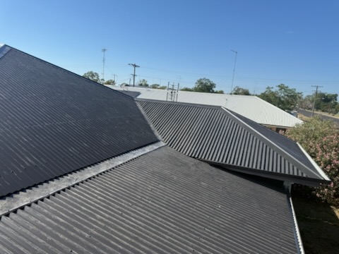 New charcoal corrugated roof across hips and valleys