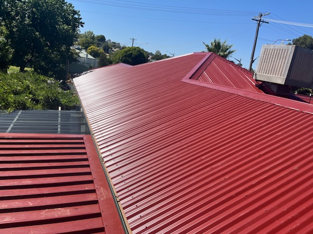 Fresh Manor Red corrugated Colorbond roof, looking down the new sheeting from the ridge